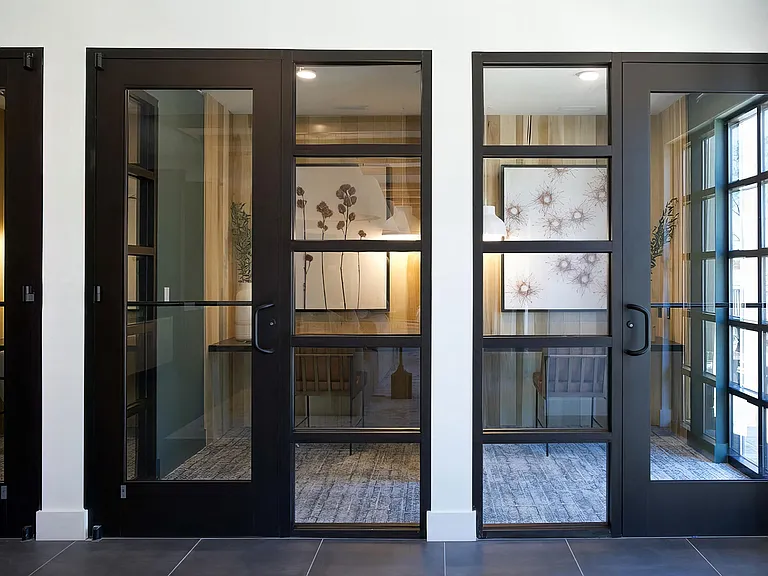Multiple private office areas with desks and cozy lighting