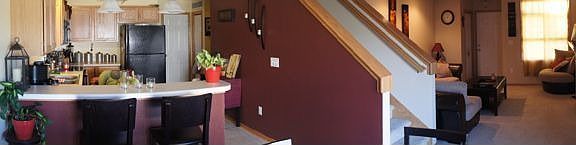 Landscape View of Kitchen, Stairway and Living Room
