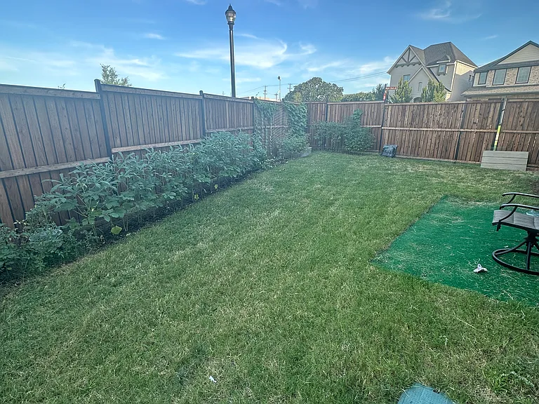 side yard with wood fencing giving privacy to the family