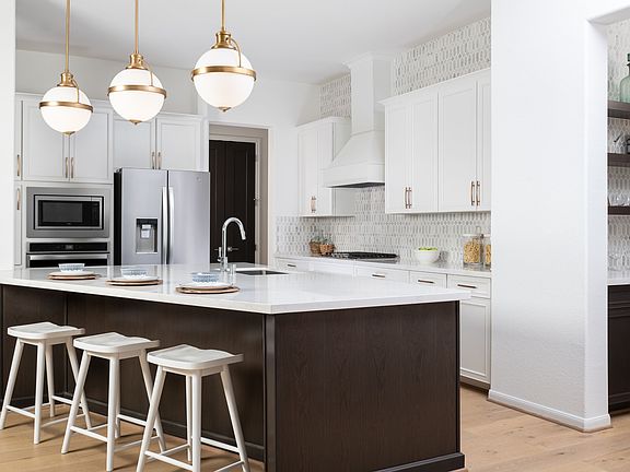 This kitchen is a chef s dream The spacious kitchen features two colored wood cabinetry with quart