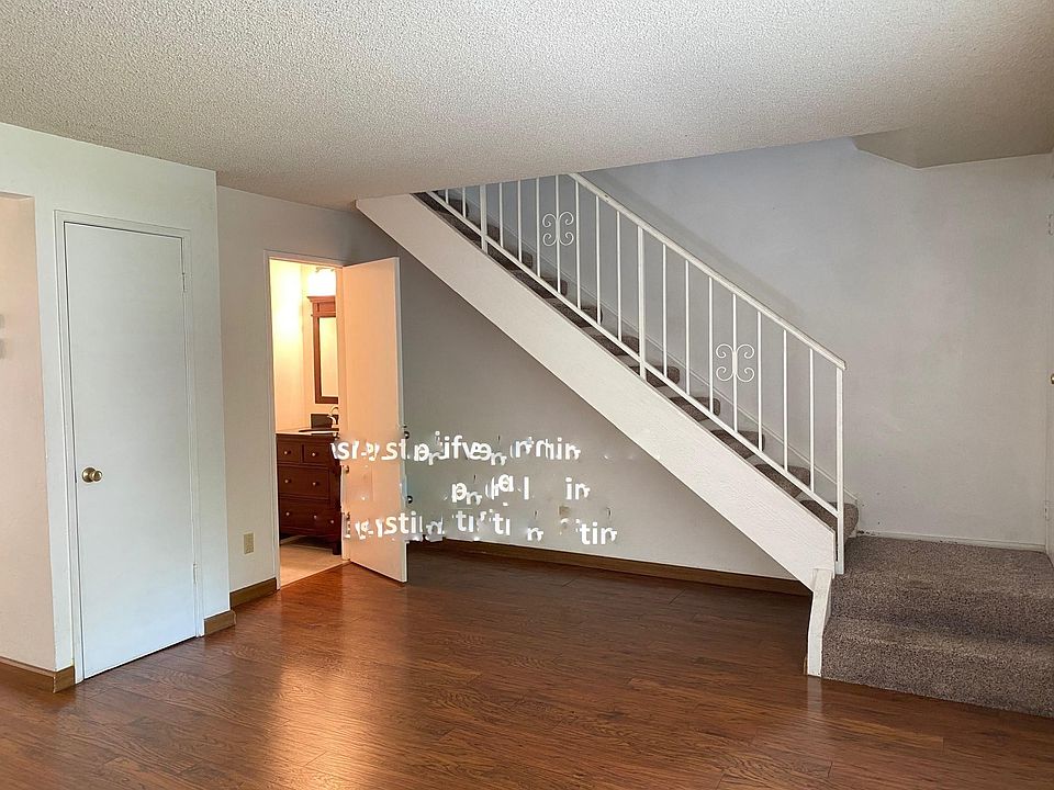 Living room with view of half-bath.