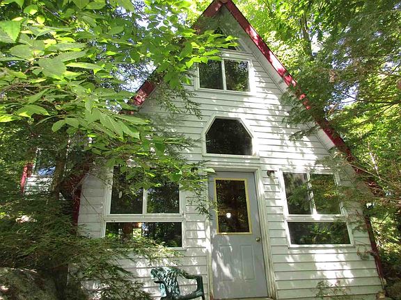 View of front of well build cabin.