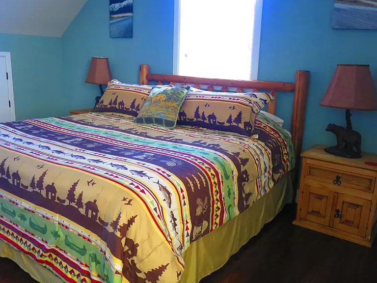 The Master bedroom is furnished with a king size bed