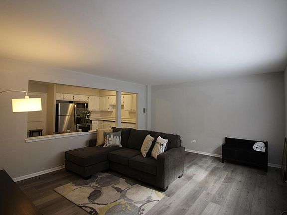 Sample furniture arrangement. Living room has A/C unit for warm weather
