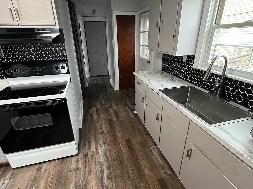 Enter apartment into kitchen