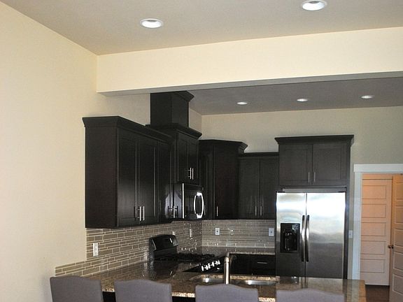 Open floor plan; view of kitchen looking towards separate laundry/mud room.