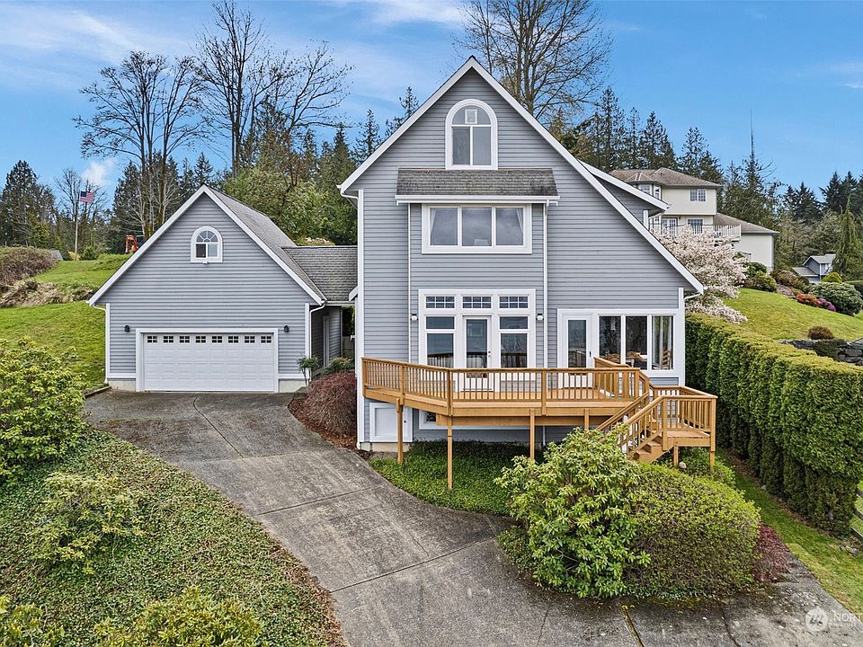 Charming custom built home nestled high above an expansive marine and mountain view!>