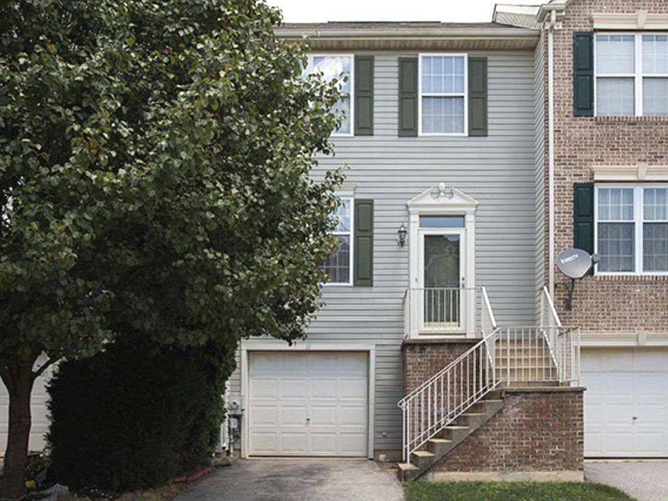 Front view with driveway