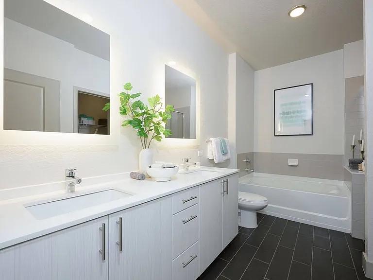 Step into a beautifully designed bathroom at The Edison Daytona Apartments, featuring modern fixtures and a spa-like ambiance. Enjoy ample space and stylish finishes that elevate your daily routine. Schedule your tour today!