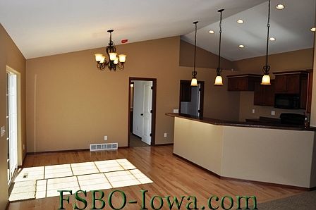 Dining Area.  Oil Rubbed Bronze lighting and hardware through out.  There are over twenty recessed lights throughout this home.  Plant ledge includes switched outlet for decorating purposes.