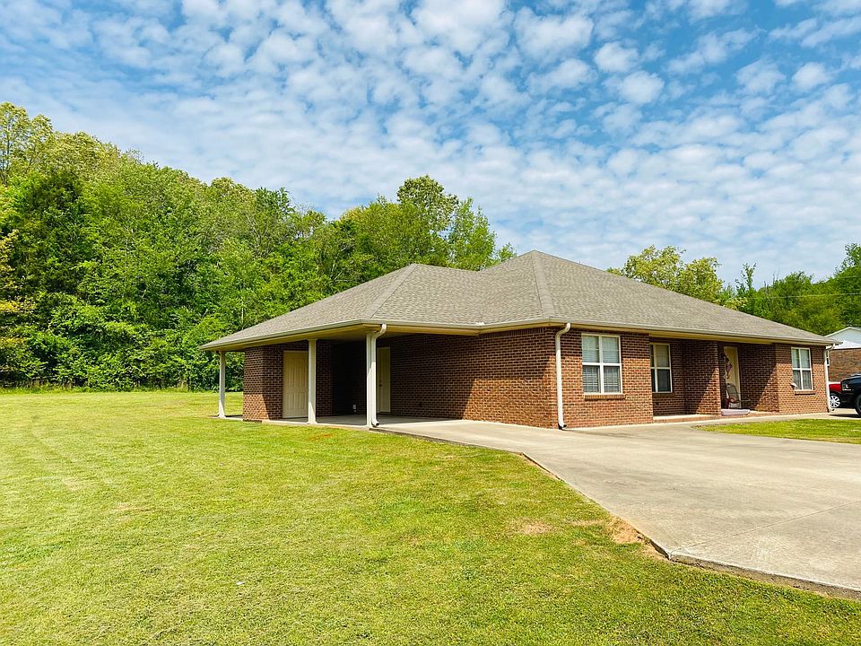 Carport, Side Door, Outdoor Closet, and Grilling Patio