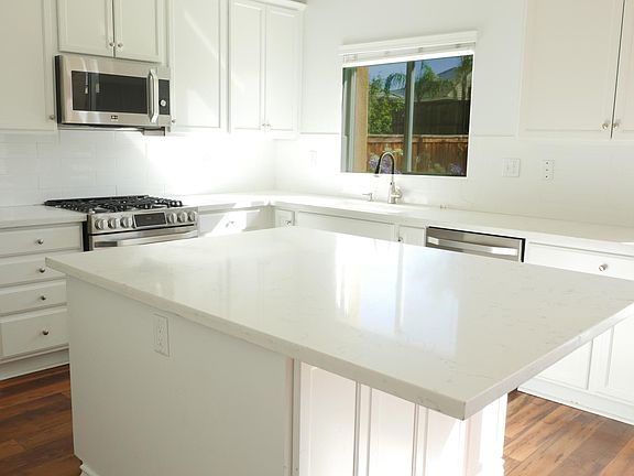 Updated kitchen with stainless steel appliances.