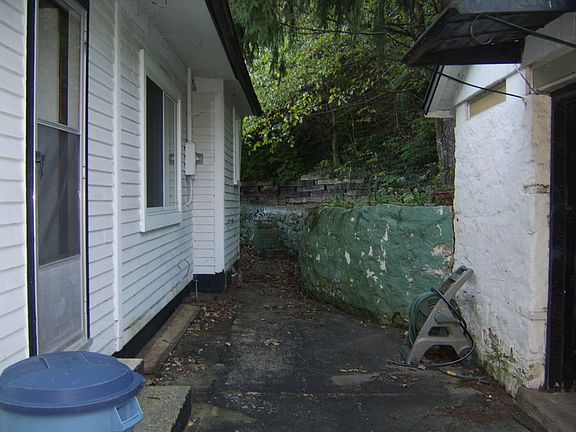 Rear view
						:
						There is an outbuilding in the rear of the home for gardening tools or hobbies.