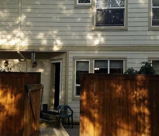 Back of unit with gated patio