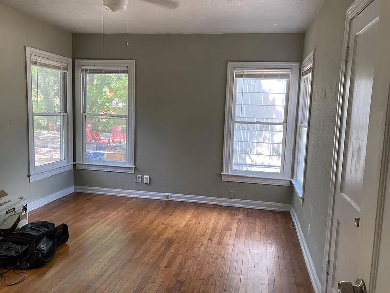 rear bedroom. large with 5 windows!