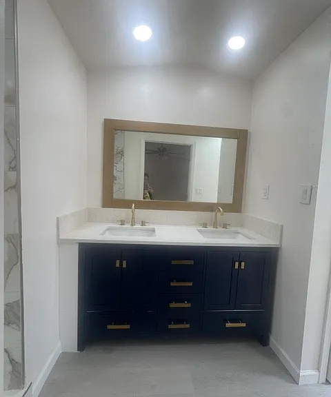 Master Bathroom Dual Sinks with Towel closet and toilet to right
