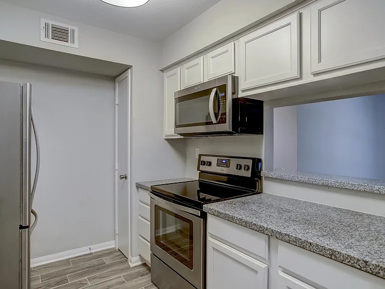 Kitchen w/all stainless steel appliances.