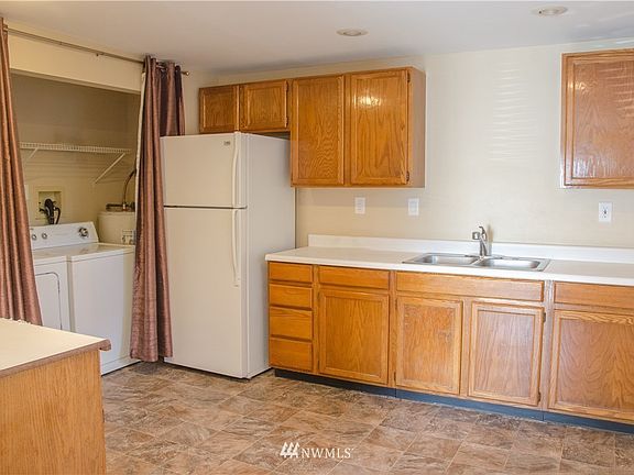 Kitchen with in unit laundry and dryer.