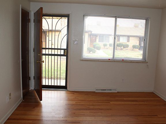 Large living room with security doors and large windows look