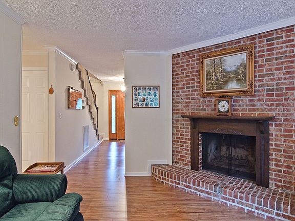 Cozy Den - beautiful brick fireplace