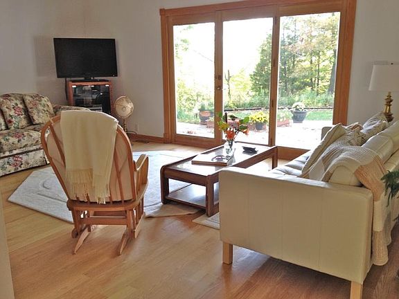 Living Room View of Cedar Deck and Nature