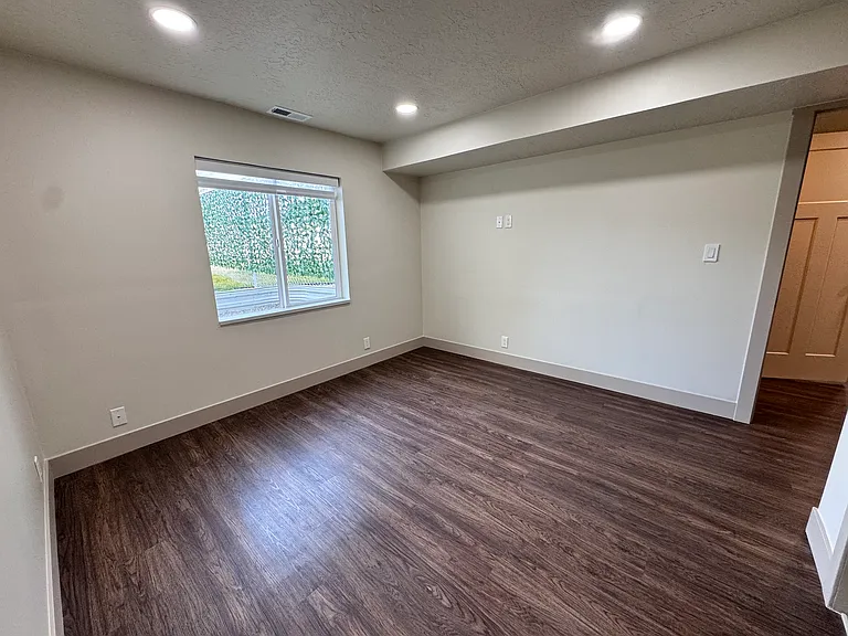 Comfortable third bedroom ideal for guests, kids, or a home office.