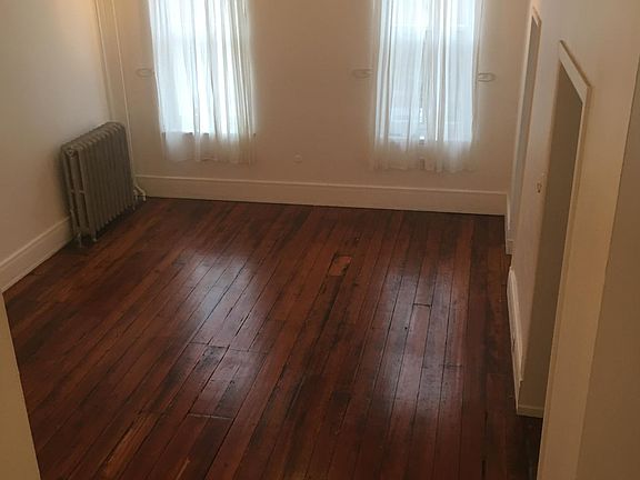 Living room faces south. 12 ft ceiling.
