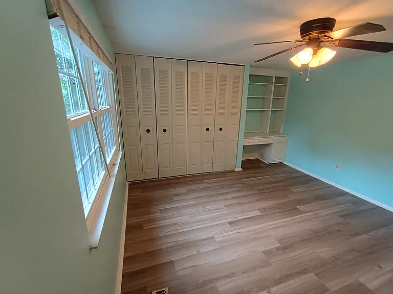 Second bedroom features large closet and wonderful built-ins.