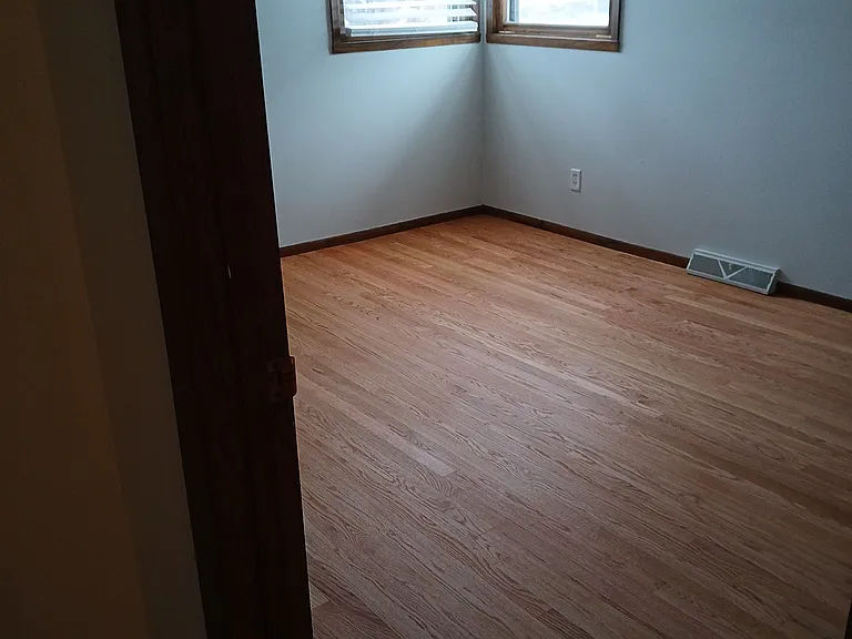 Hardwood floors in 3 bedrooms and hallway re-finished 12-23-24. This is the big b-room with 1/2 bath.