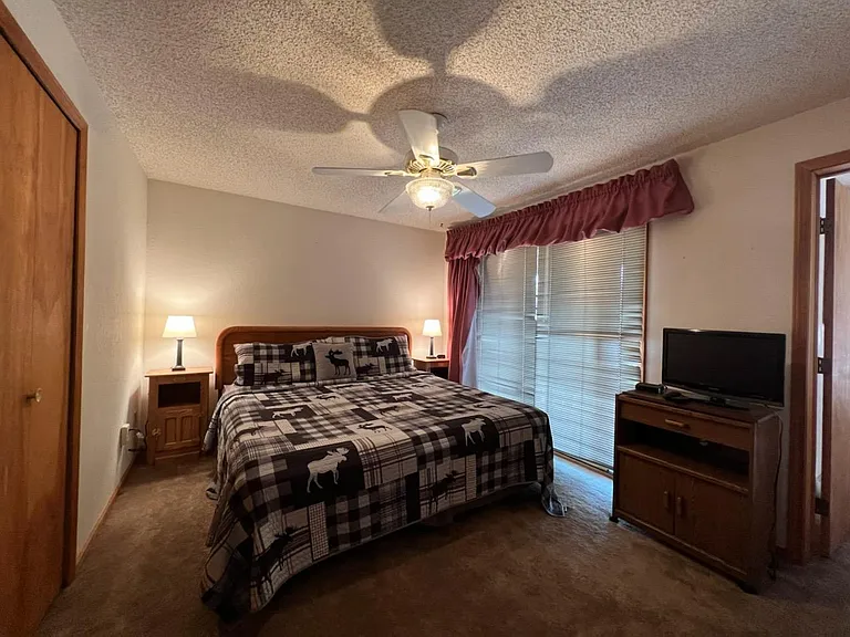 Primary bedroom with private balcony.