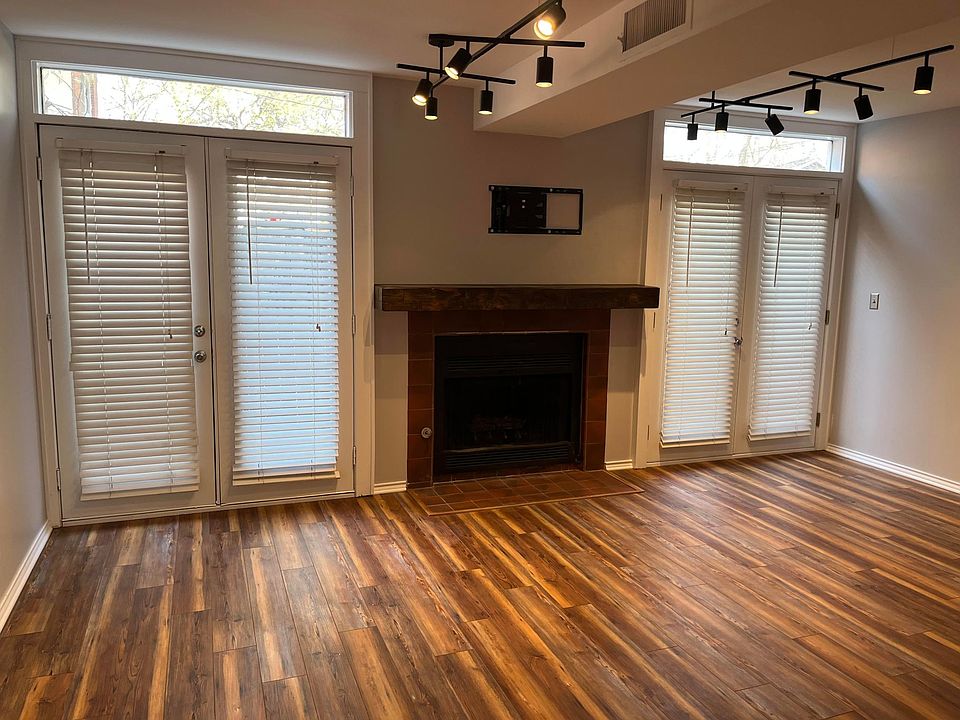 Dimmable LED lighting. Gas fireplace. Double French doors to private, fenced patio.