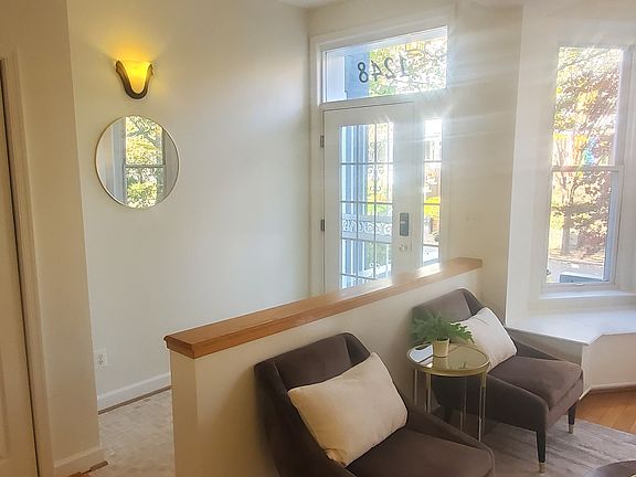 Foyer living room equipped with a walking closet.