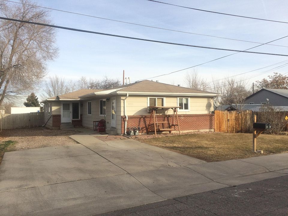 Unit A exterior. Side door is main entrance to Unit A. Rear door is entrance to Unit B. Fence on right side has gate to side yard area.