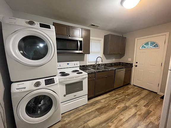 Full kitchen with washer and dryer