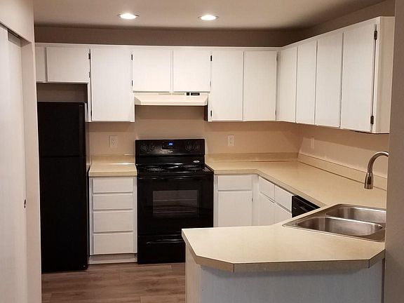 Spacious kitchen, plenty of cabinets, pantry on left and ample counter space.