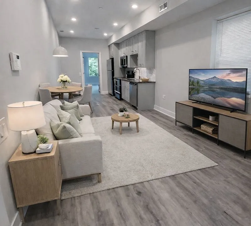 Living - Dining - Kitchen - rendered as furnished - front view with rear bedroom in sight