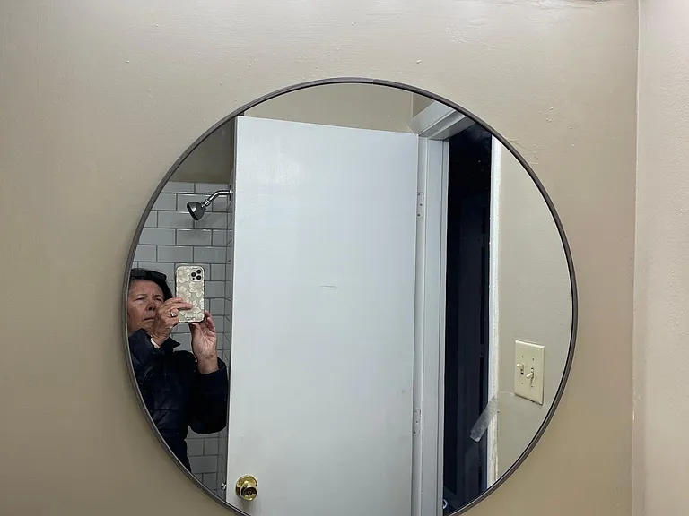 Remodeled Bathroom. Freshly painted, new mirror and light.