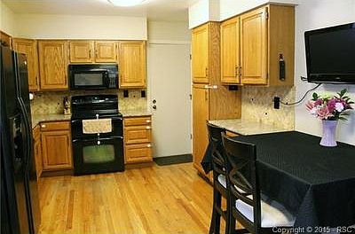 Granite counter tops, travertine backsplash, hardwood floors, oa
