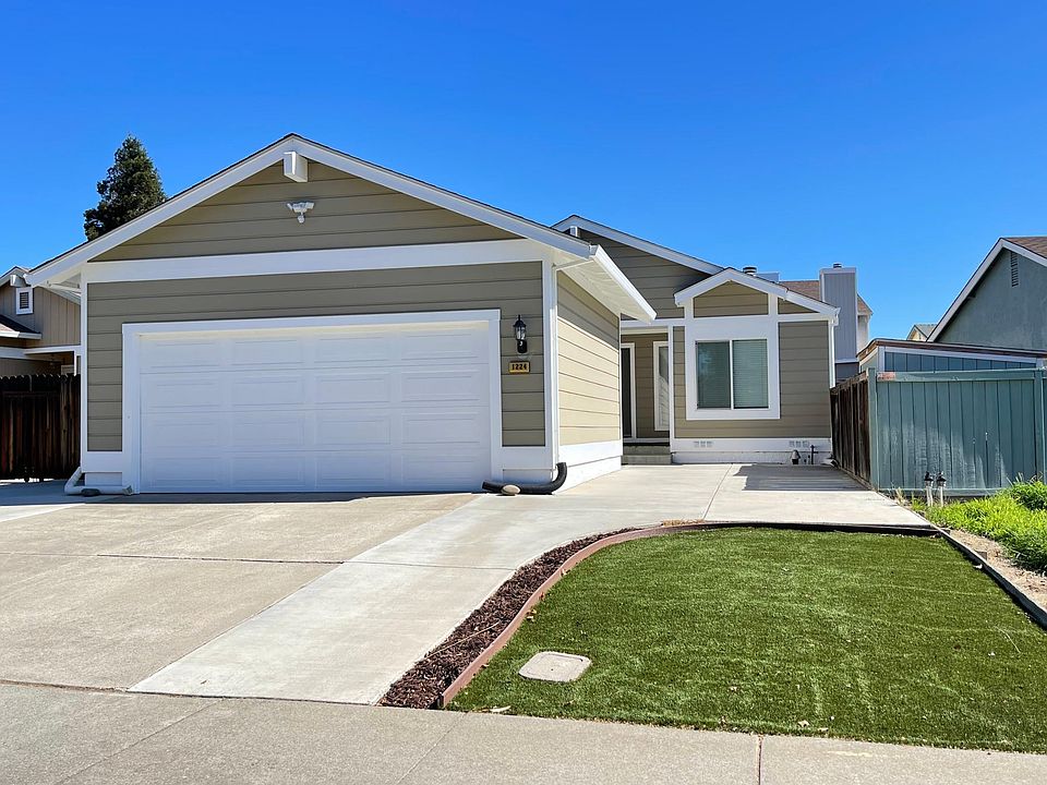 Frontal view with detached garage