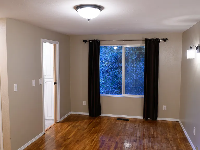 One side of the master bedroom with northern views of the back yard.