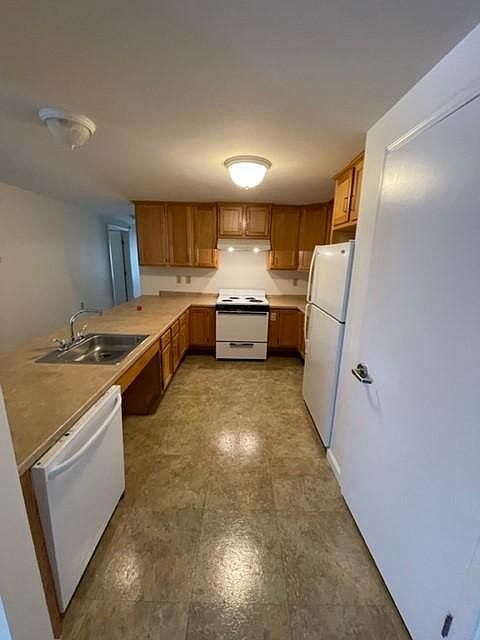 Kitchen with dishwasher, stove and fridge. Large pantry.