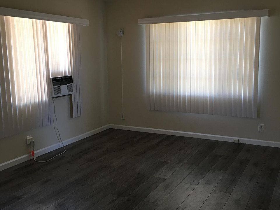 living room with hard wood floors and ac