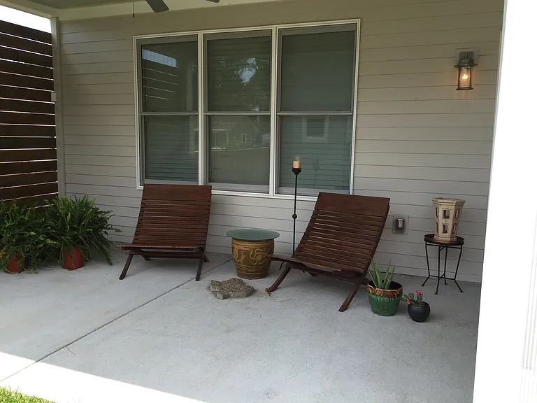 Enjoy the rainstorms on this covered patio which also has a ceiling fan