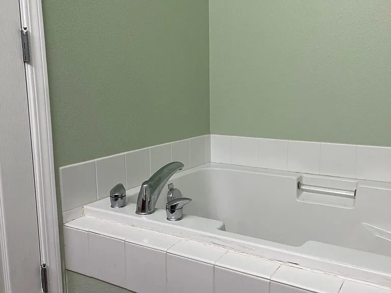 Large soaking tub in main bathroom.