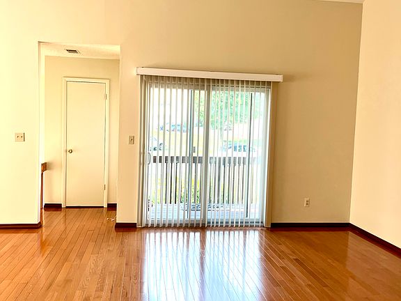 Entry with closet - Living Room featuring gleaming Hardwood Floors