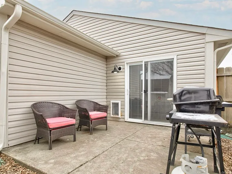Back patio area ideal for outdoor seating or grilling.