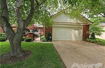 Enter through wrought iron gates to beautifully landscaped court