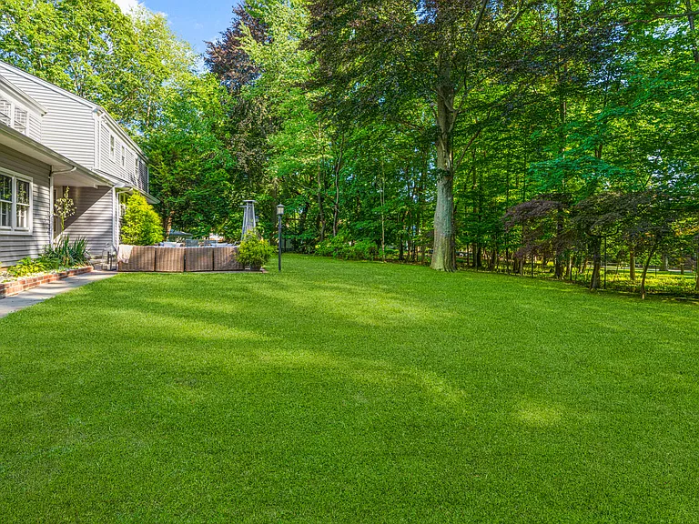 Gorgeous private yard with mature trees.
