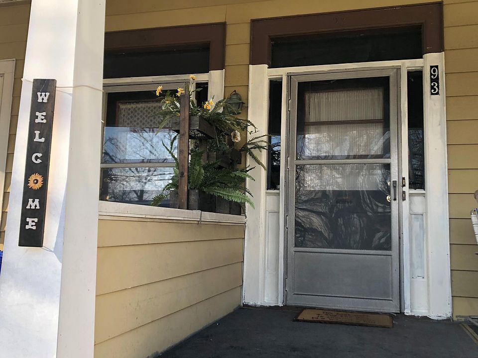 Welcoming front door with large porch