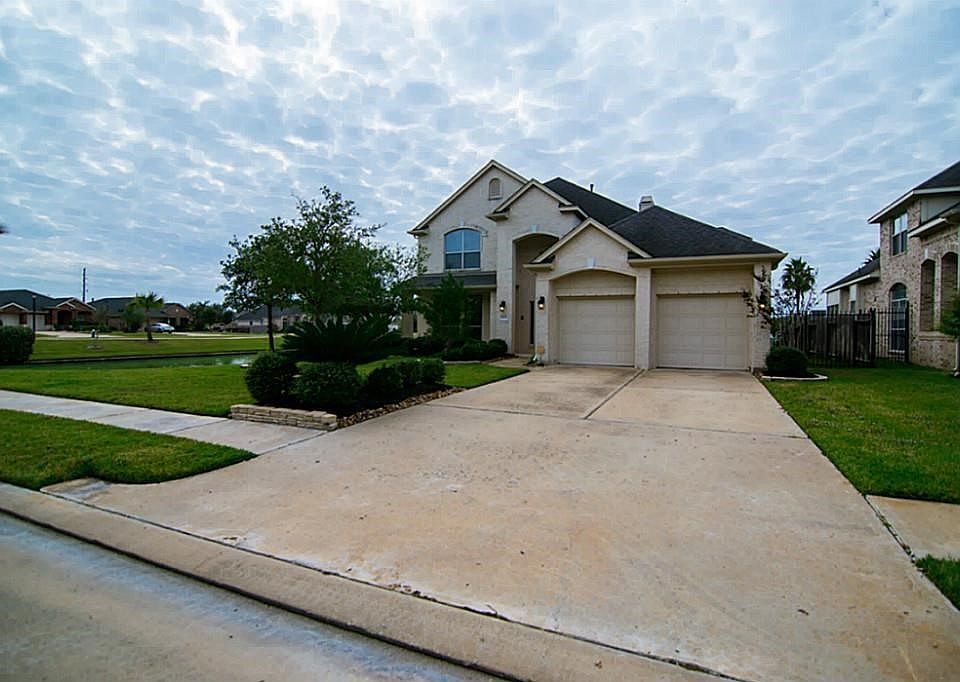 Another view of the front elevation and two car driveway and garage